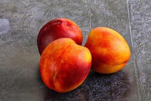 Ripe sweet juicy fresh red nectarines photo