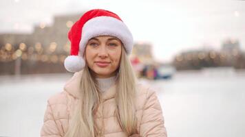 Young smiling woman on ice rink. video