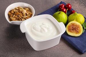 Traditional homemade Greek yoghurt with granola photo