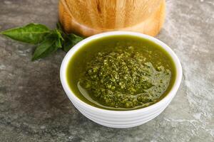 Homemade vegetarian basil pesto sauce photo