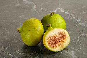 Ripe sweet juicy green fig heap photo