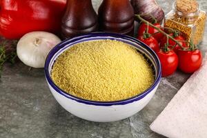 Raw dry wheat couscous grain photo