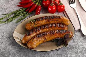 Grilled meat sausages with spices photo
