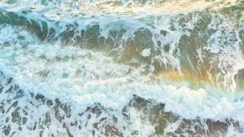 Aerial view of wave on the beach with sand and turquoise waves video