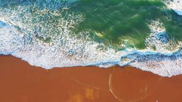 Aerial view of wave on the beach with sand and turquoise waves video