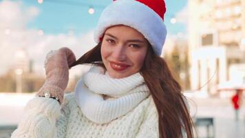 Young smiling woman ice skating outside on ice rink. video