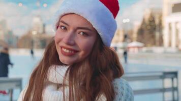 Young smiling woman ice skating outside on ice rink. video