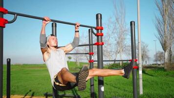 Male athlete engaged on sports ground outdoor in park. video