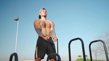 Male athlete engaged on sports ground outdoor in park. video