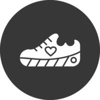 Zapatos glifo invertido icono vector