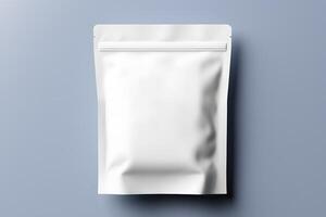 Blank white aluminium or plastic pouch packaging mockup isolated on blue background. With clipping Path included. photo