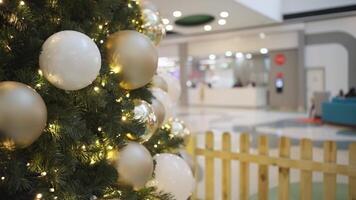 a christmas tree with decorations in a mall video