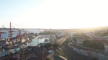 Aerial view on Lisbon commercial harbor on sunset, containers on pier with freight cranes, Portugal video