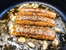 Fresh Salmon filet with herbs and spices photo