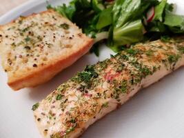 Fresh Salmon filet with herbs and spices photo