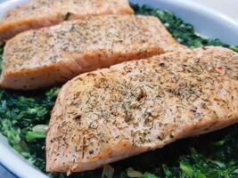 Fresh Salmon filet with herbs and spices photo