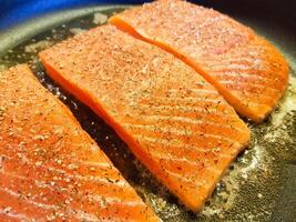 Fresh Salmon filet with herbs and spices photo