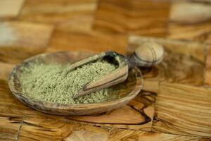 Sage leaves on olive wood photo