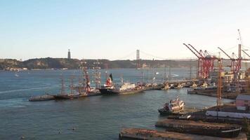 Aerial view on Lisbon commercial harbor, containers on pier with freight cranes. video