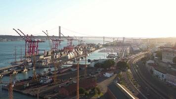 Aerial view on Lisbon commercial harbor, containers on pier with freight cranes. video