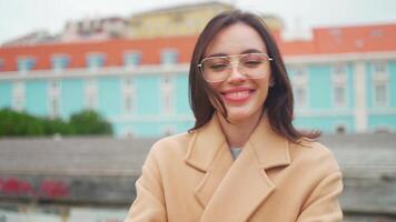 a woman in glasses is smiling video