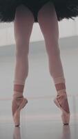 lose-up of ballerina's legs in pointe shoes. Ballerina is standing on tiptoe. Ballet dance. video