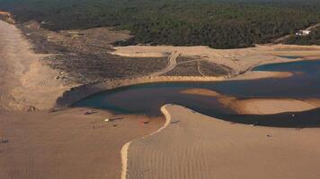 Aerial view of sandy landscape next to atlantic ocean coast. video