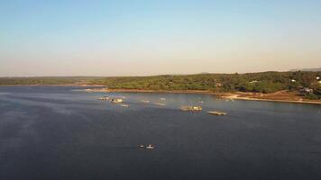 Aerial view of fishing boats on natural lake near Atlantic Ocean. video