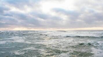 Aerial view of ocean horizon with sunset sky fly over. video