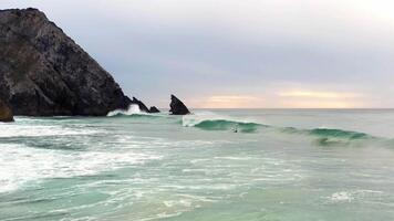 Aerial view of wave on the beach with sand and turquoise waves video