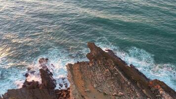 Aerial view of wave on the beach with sand and turquoise waves video