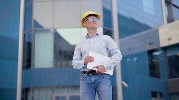 Business. Engineer Worker Protective Helmet Use Laptop Controls Working Process Inspector Supervisor Yellow Hard Hat Glasses Transportation Company Office Building And Truck Background video