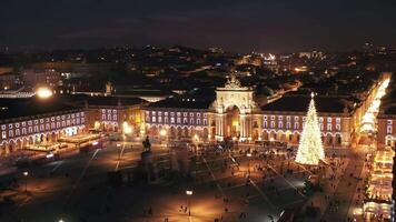 Aerial view on illuminated Christmas tree in Lisbon on Commerce Square, video
