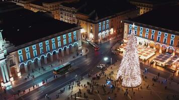 Aerial view on illuminated Christmas tree in Lisbon on Commerce Square, video