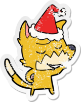 friendly hand drawn distressed sticker cartoon of a fox wearing santa hat png