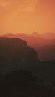 dramatic sky over rocky mountains at sunset video