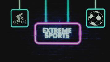 Extreme Sports appearing inscription in pink neon frame on dark bricks background with sports symbols. Sports concept video