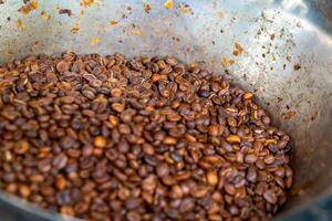 a bowl full of roasted coffee beans photo