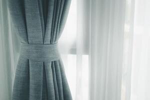 Curtain decotaion on window in home. photo