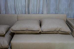 Part of the leather sofa and pillows photo