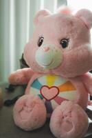 Bangkok, Thailand - April 2, 2024 Cute a pink Care Bears. Teddy bear dolls Care Bears photo