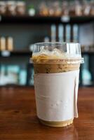 Ice coffee espresso cup in a plastic glass photo