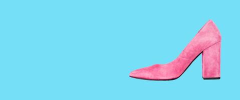 Heeled shoes, fashion modern pink suede footwear on clear blue background, banner photo