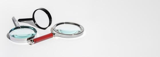 Glass magnify tool for business research. SEO concept with marketing and advertising focus. photo
