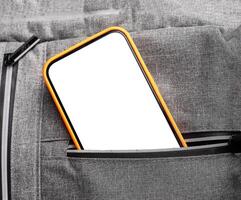 Mobile phone screen mockup sticking out from pocket. Smartphone display mock up peeking photo