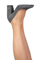 Women legs raised up, wearing gray heeled shoes isolated on white photo