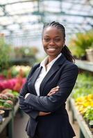 Black Business Woman in a Garden Center Surrounded by Greenery photo