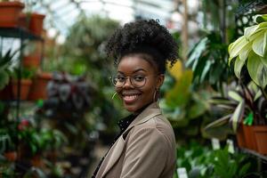Black Business Woman in a Garden Center Surrounded by Greenery photo