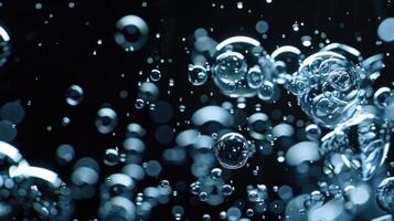Water bubbles on black background photo