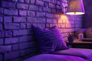 brick wall interior purple pillow and lamp decor photo